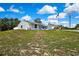 Single-story home features manicured landscaping, a front-facing garage, and a neatly maintained lawn at 4360 Talco Ave, Spring Hill, FL 34609