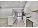 Kitchen with stainless steel appliances, island, and white cabinets at 4360 Talco Ave, Spring Hill, FL 34609