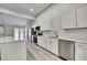 Kitchen with stainless steel appliances, island, and white cabinets at 4360 Talco Ave, Spring Hill, FL 34609