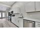 Kitchen with stainless steel appliances, island, and white cabinets at 4360 Talco Ave, Spring Hill, FL 34609