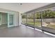 Inviting screened porch with access to the backyard, perfect for outdoor relaxation at 4360 Talco Ave, Spring Hill, FL 34609