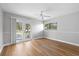 Spacious bedroom with private balcony access, offering scenic views and a bright, airy ambiance at 4439 Reeves Rd, New Port Richey, FL 34652