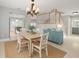 Bright dining area, open floor plan, and stairs leading to 2nd floor at 4439 Reeves Rd, New Port Richey, FL 34652