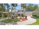 Traditional style home with lush landscaping and a circular driveway at 4439 Reeves Rd, New Port Richey, FL 34652