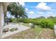 A shot of the backyard featuring a patio area with natural scenery behind the property at 4543 Dewey Dr, New Port Richey, FL 34652