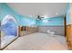 Bright bathroom featuring tiled floors, toilet, and partially renovated walls at 4543 Dewey Dr, New Port Richey, FL 34652