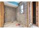Unfinished bathroom construction with exposed block walls and plumbing at 4543 Dewey Dr, New Port Richey, FL 34652