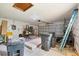 Spacious garage with an automatic door, ladder and miscellaneous items at 4543 Dewey Dr, New Port Richey, FL 34652