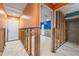 Hallway with orange walls and framing, leading to a room with blue walls at 4543 Dewey Dr, New Port Richey, FL 34652