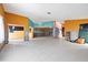 Open living space undergoing renovation with color block walls and tile flooring at 4543 Dewey Dr, New Port Richey, FL 34652