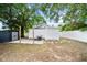 The backyard features a grill, storage shed, stepping stones and white picket fence, great for outdoor living at 4622 Paloverde Dr, New Port Richey, FL 34652