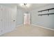 Cozy bedroom showcasing carpet flooring, blue walls, and minimalist wall shelves at 4622 Paloverde Dr, New Port Richey, FL 34652