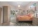 An exquisite bedroom with pool view, decorative rug, and a unique armoire and bed set at 5072 Abbonmarsh Cir, Brooksville, FL 34604
