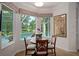 Cozy breakfast nook with a tranquil view of the pool and well-maintained landscaping at 5072 Abbonmarsh Cir, Brooksville, FL 34604