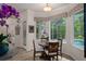 Charming breakfast nook with views of the pool and outdoor space at 5072 Abbonmarsh Cir, Brooksville, FL 34604