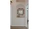 Hallway featuring a decorative mirror in an alcove niche at 5072 Abbonmarsh Cir, Brooksville, FL 34604