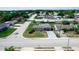 This is an aerial view of a neighborhood featuring sidewalks, lush trees, and well-maintained residential properties at 5543 Moog Rd, New Port Richey, FL 34652