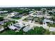 Areal view of a residential neighborhood featuring well-maintained homes with neat yards and many mature trees at 5543 Moog Rd, New Port Richey, FL 34652