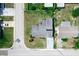 An aerial view showcases this home and its surroundings in a residential neighborhood at 5543 Moog Rd, New Port Richey, FL 34652