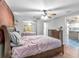 Comfortable bedroom with hardwood floors, a ceiling fan, and ample closet space at 5543 Moog Rd, New Port Richey, FL 34652