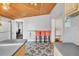 Efficient kitchen design with a breakfast bar, ample counter space, and access to an additional room at 5543 Moog Rd, New Port Richey, FL 34652