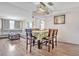 Open-concept living and dining areas perfect for entertaining, featuring wood-look floors and neutral decor at 5543 Moog Rd, New Port Richey, FL 34652