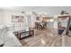 Spacious living and dining areas featuring wood-look floors, neutral paint, and ample natural light at 5543 Moog Rd, New Port Richey, FL 34652