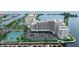 Aerial view of building with tennis courts, parking and beautiful water views at 6035 Sea Ranch Dr # 410, Hudson, FL 34667