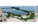 Aerial view featuring private sandy beach, lounge chairs, patio and water view at 6035 Sea Ranch Dr # 410, Hudson, FL 34667
