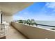 Relaxing balcony with seating and stunning views of the serene ocean and lush greenery at 6035 Sea Ranch Dr # 410, Hudson, FL 34667