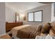 Bedroom with a cozy bed, matching dresser and window with blinds for privacy at 6035 Sea Ranch Dr # 410, Hudson, FL 34667