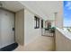 Private condo entryway with secure gate and inviting decor, providing a welcoming first impression at 6035 Sea Ranch Dr # 410, Hudson, FL 34667