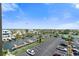 Scenic aerial view of parking and a canal showcasing waterfront community living at 6035 Sea Ranch Dr # 410, Hudson, FL 34667