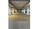 Spacious parking garage with ample lighting and designated parking spaces for residents at 6035 Sea Ranch Dr # 410, Hudson, FL 34667