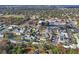 Scenic aerial shot of a residential neighborhood with well-maintained homes, lush landscaping, and serene surroundings at 6702 Dartmoor Ln # 7A, New Port Richey, FL 34653