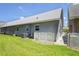 The exterior features neutral siding and a small grassy yard at 6702 Dartmoor Ln # 7A, New Port Richey, FL 34653