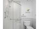 This bathroom features updated fixtures, a walk-in shower with updated shower head and handle bars at 6702 Dartmoor Ln # 7A, New Port Richey, FL 34653