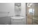 Bright bathroom features a vanity with storage and a mirrored medicine cabinet at 6702 Dartmoor Ln # 7A, New Port Richey, FL 34653