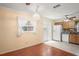 This kitchen area features tile floors, hardwood, lots of natural light and modern appliances at 6702 Dartmoor Ln # 7A, New Port Richey, FL 34653