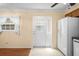 Bright kitchen area featuring tile floors, lots of natural light and modern appliances at 6702 Dartmoor Ln # 7A, New Port Richey, FL 34653
