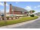 The Wilds Recreation Center with landscaped entrance and well-maintained grounds at 6702 Dartmoor Ln # 7A, New Port Richey, FL 34653