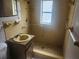 Bathroom featuring a walk-in shower, sink, and toilet at 7338 Foxbloom Dr, Port Richey, FL 34668