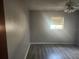 Spacious bedroom featuring a ceiling fan, and modern wood flooring at 7338 Foxbloom Dr, Port Richey, FL 34668