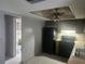 Functional kitchen with black appliances, neutral countertops, and a convenient layout at 7338 Foxbloom Dr, Port Richey, FL 34668
