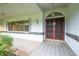 Inviting covered front entry featuring double doors and decorative accents at 8522 Cranes Roost Dr, New Port Richey, FL 34654