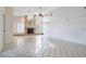 Spacious living room with a stone fireplace, tiled floors, and natural light at 8522 Cranes Roost Dr, New Port Richey, FL 34654