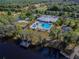 Community amenities include pool, playground, and lake access with dock at 9309 Edistro Pl, New Port Richey, FL 34654