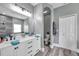 Bathroom showcasing the double vanity and updated finishes at 9309 Edistro Pl, New Port Richey, FL 34654