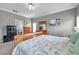Bright bedroom with dresser and large wall art at 9309 Edistro Pl, New Port Richey, FL 34654