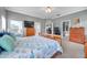 Primary bedroom featuring an exterior door and walk-in closet entrance at 9309 Edistro Pl, New Port Richey, FL 34654